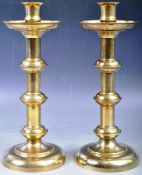 PAIR OF 19TH CENTURY BRASS GOTHIC INFLUENCE CANDLESTICKS