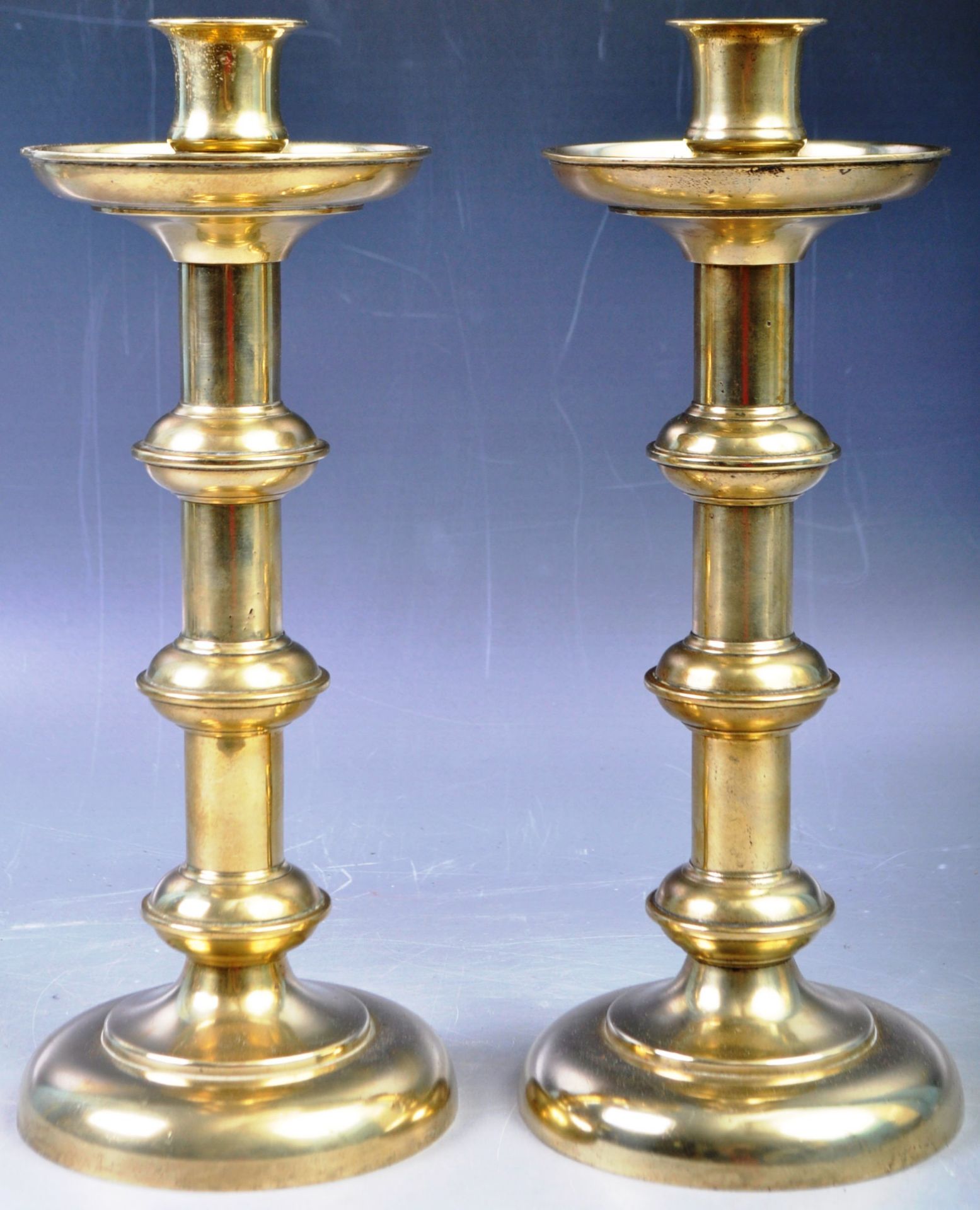 PAIR OF 19TH CENTURY BRASS GOTHIC INFLUENCE CANDLESTICKS