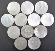 TWELVE 19TH CENTURY CHINESE MOTHER OF PEARL GAMING TOKENS