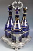 SET OF GEORGIAN BRISTOL BLUE DECANTER BOTTLES IN STAND