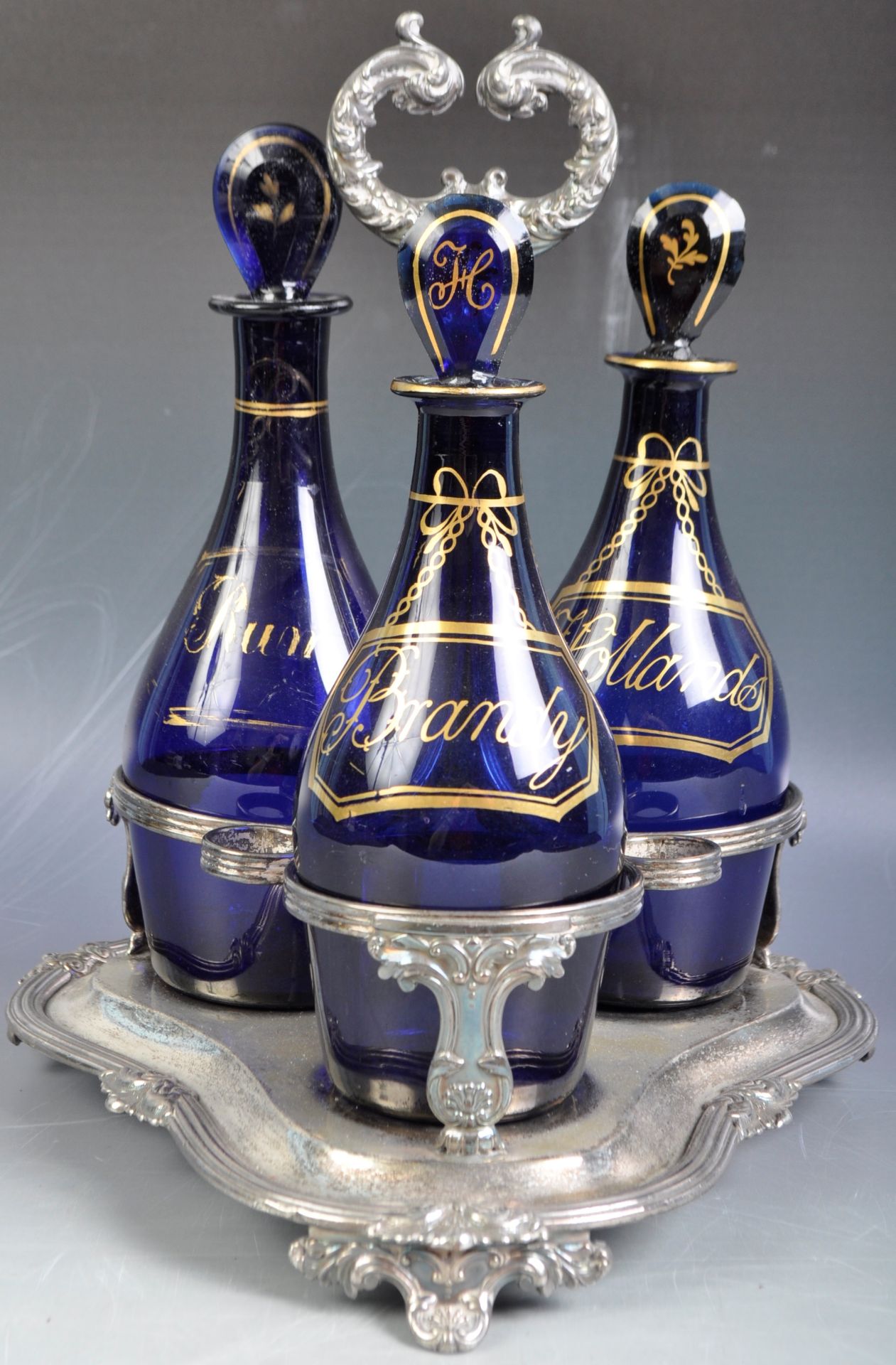 SET OF GEORGIAN BRISTOL BLUE DECANTER BOTTLES IN STAND