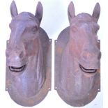 MATCHING PAIR OF HEAVY CAST IRON EXTERIOR HORSE HEAD MASKS