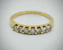 A Hallmarked 18ct Gold & Diamond Seven Stone Ring