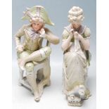 PAIR OF 20TH CENTURY BISQUE FIGURINES OF A COUPLE