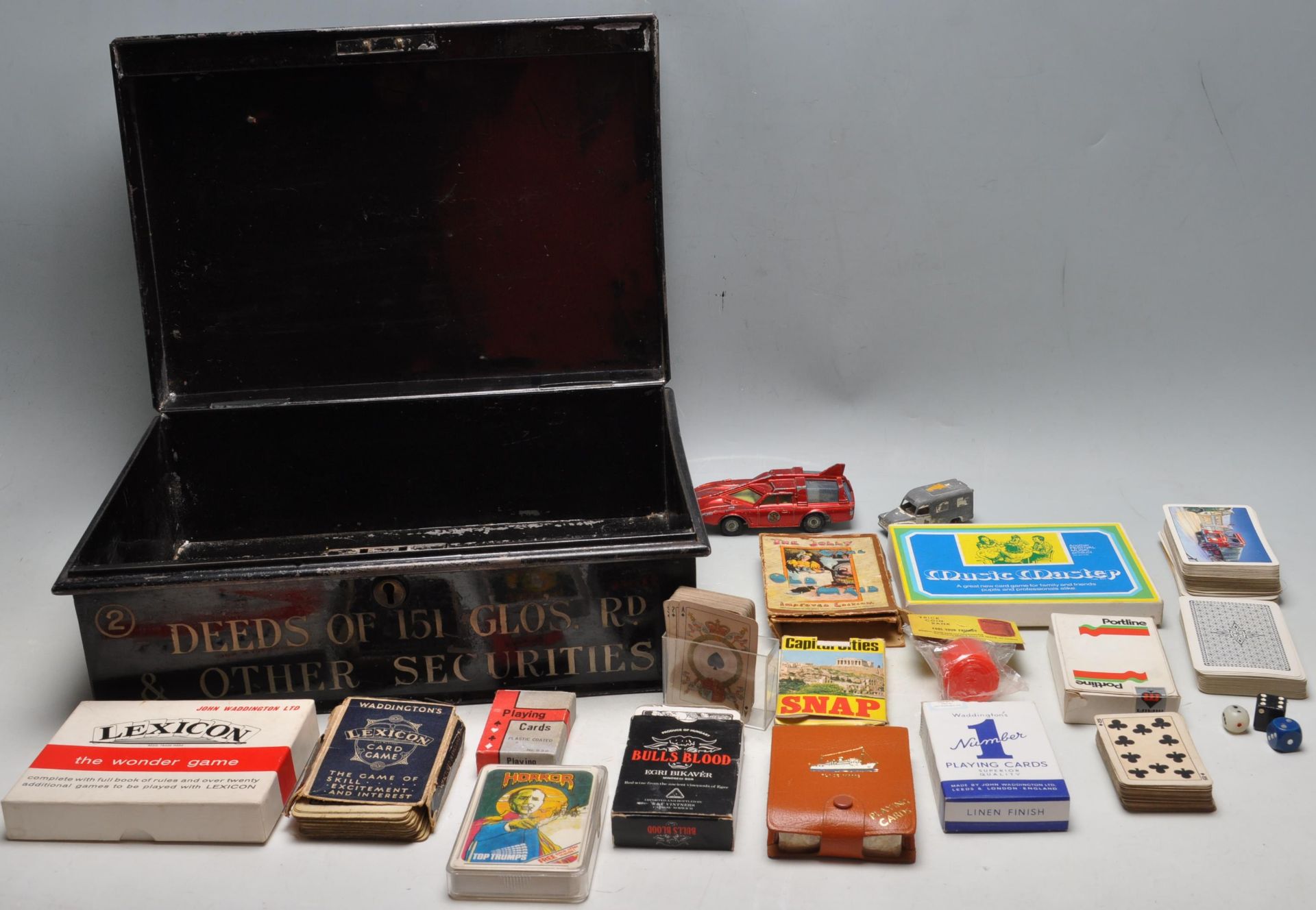 20TH CENTURY BLACK METAL BRISTOL DEEDS BOX FILLED WITH VINTAGE PARLOUR GAMES AND PLAYING CARDS