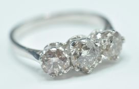 18 CT GOLD AND THREE STONE DIAMOND RING