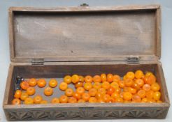 GROUP OF VINTAGE AMBER COLOURED BEADS