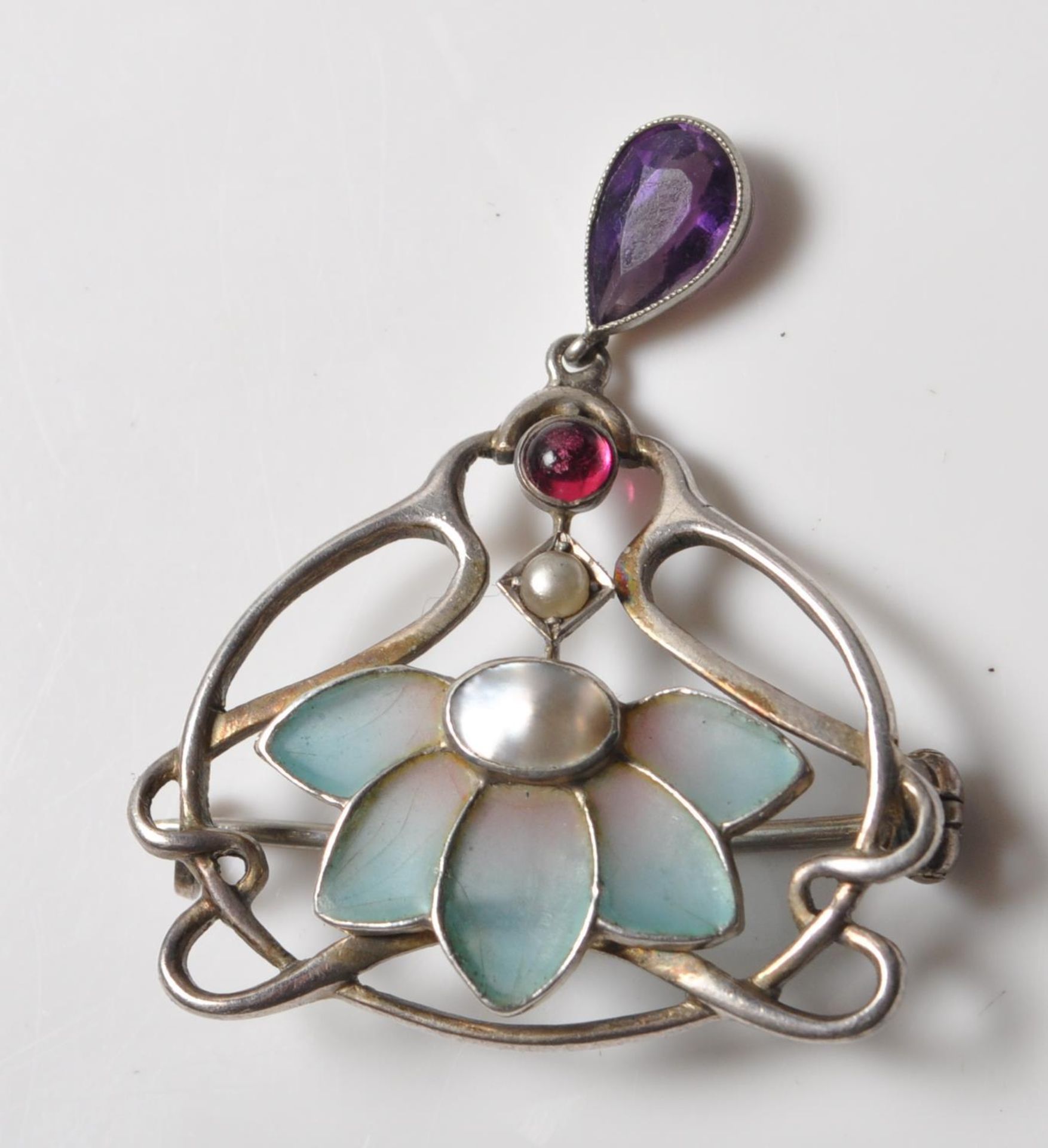 ART NOUVEAU SILVER AND PILQIE A JOUR BROOCH