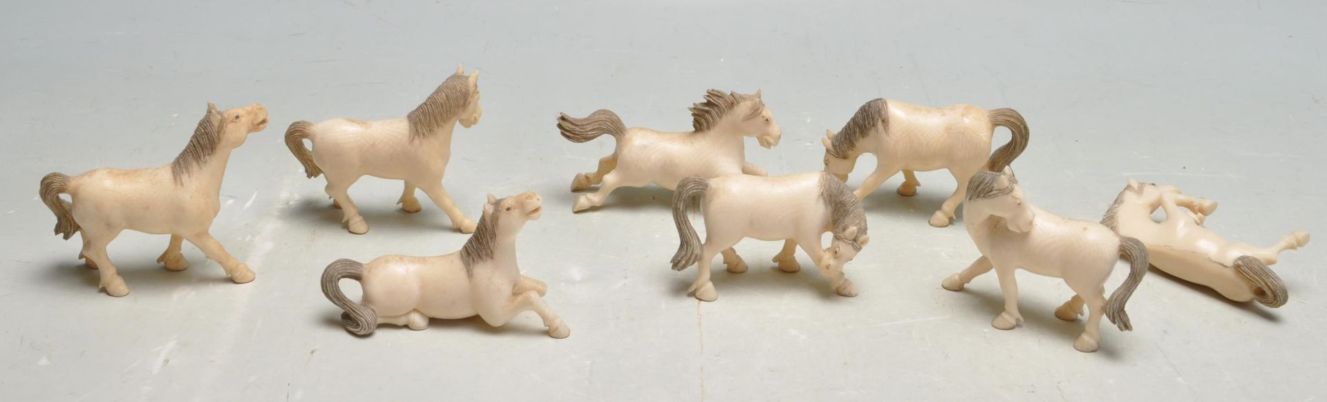 COLLECTION OF EIGHT EARLY 20TH CENTURY CARVED BONE HORSES