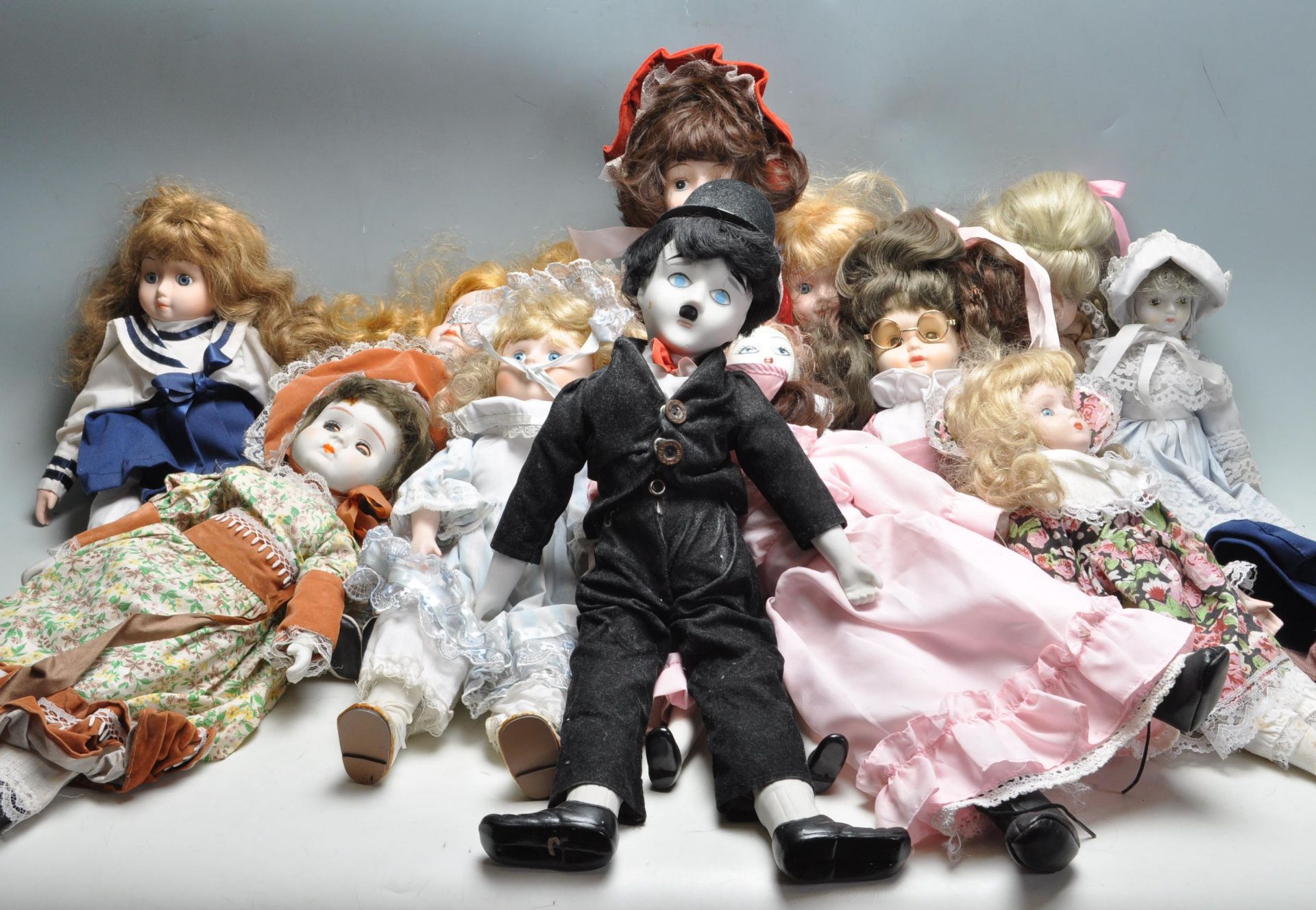 LARGE QUANTITY OF VINTAGE PORCELAIN DOLLS