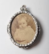 ANTIQUE SILVER PLATED PHOTO LOCKET