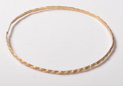 20TH CENTURY GOLD ARM BANGLE BRACELET