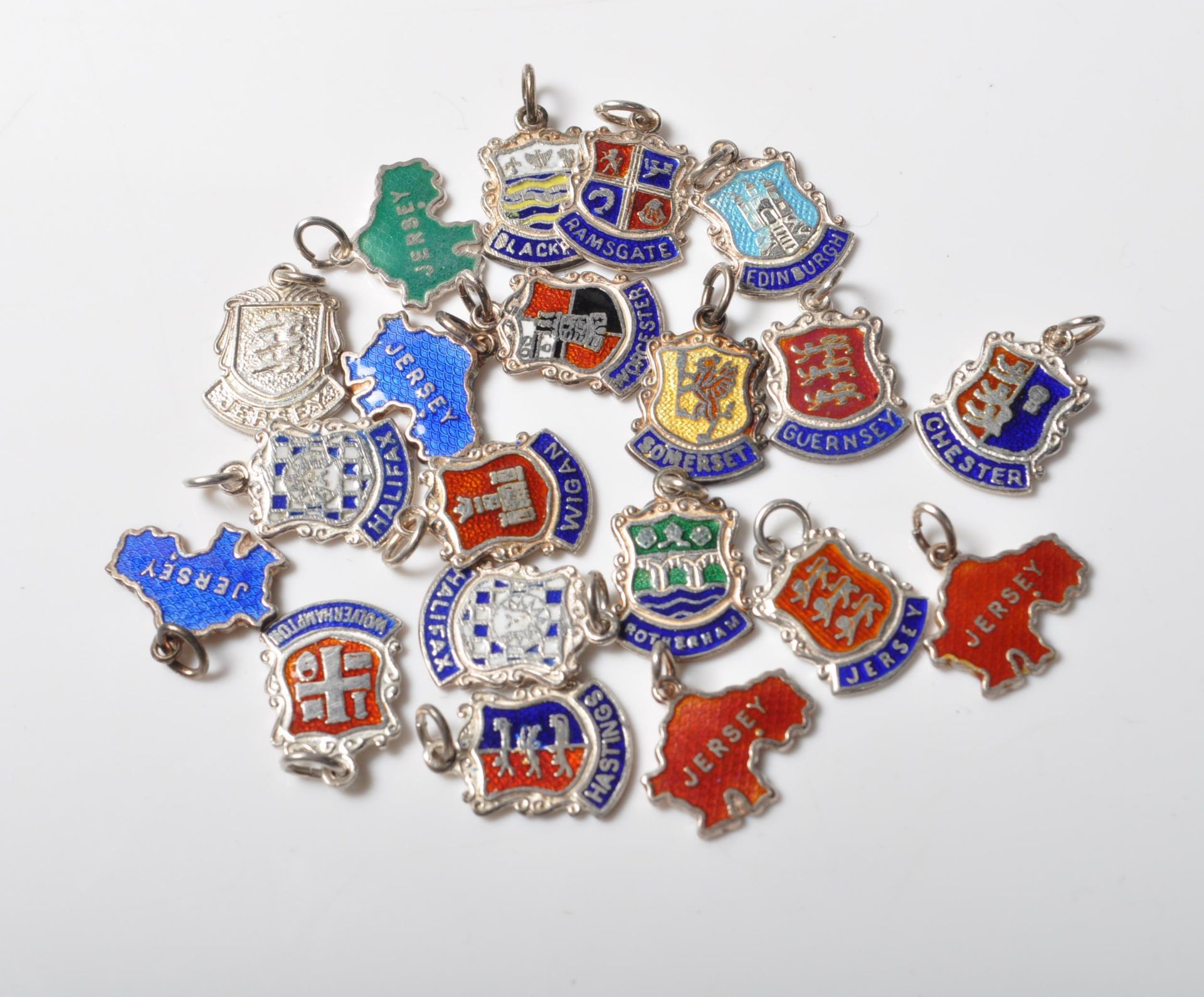 GROUP OF TWENTY SILVER SOUVENIR CHARMS