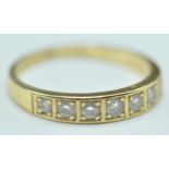 18CT GOLD & DIAMOND HALLMARKED SEVEN STONE RING