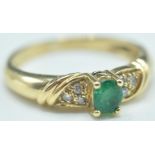 18CT GOLD EMERALD & DIAMOND RING