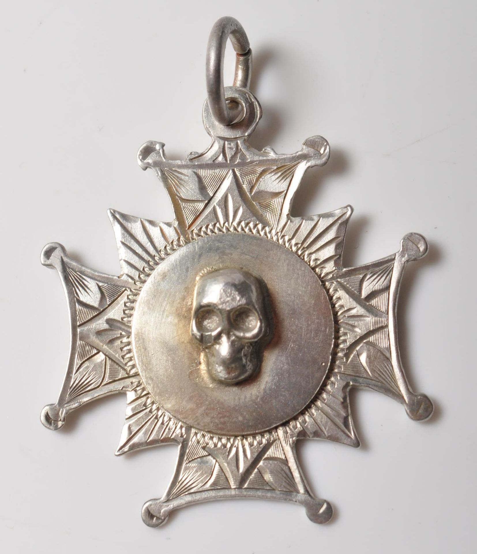 19TH CENTURY VICTORIAN STERLING SILVER SKULL FOB MEDAL.