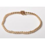 14CT GOLD DIAMOND SET BRACELET