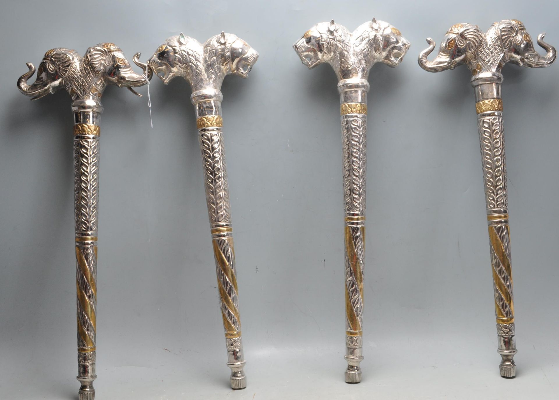 COLLECTION OF TRIBAL STYLE METAL CEREMONIAL STAFF ENDS