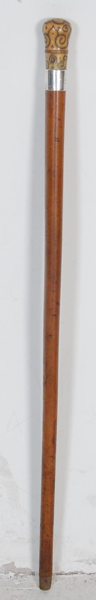 A 20TH CENTURY MALACCA AND BONE WALKING STICK WITH HALLMARKED SILVER COLLAR.