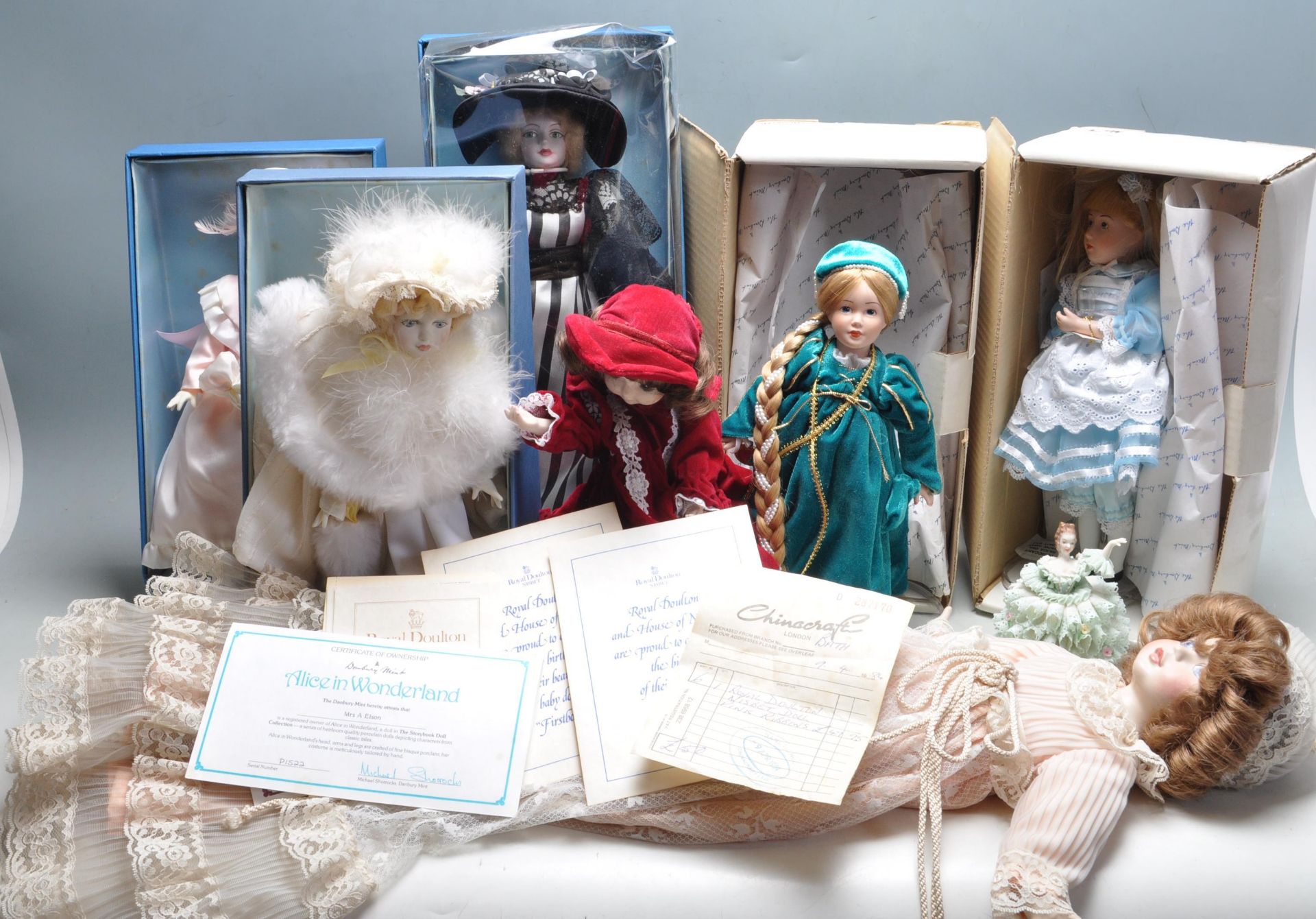 GROUP OF ROYAL DOULTON AND DANBURY MINT DOLLS