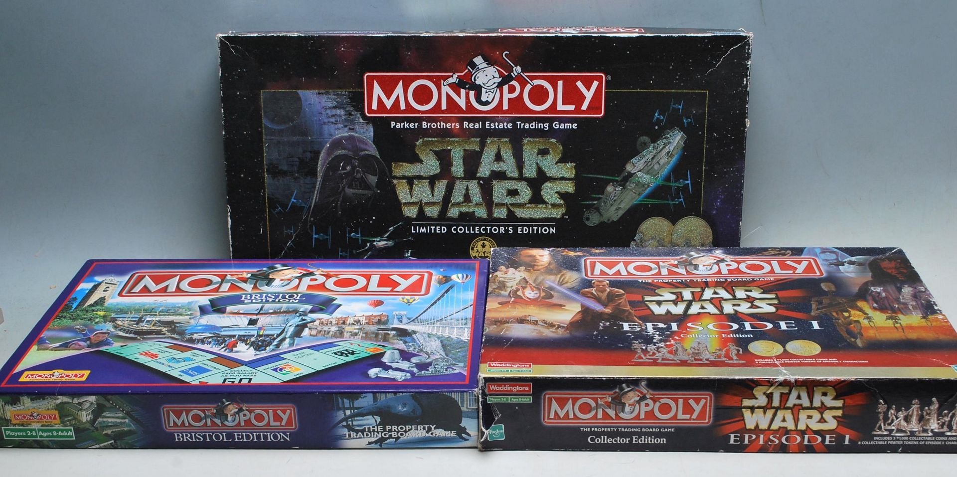 COLLECTION OF THREE CONTEMPORARY MONOPOLY BOARD GAMES