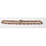 9CT GOLD RED STONE AND DIAMOND LINE BRACELET