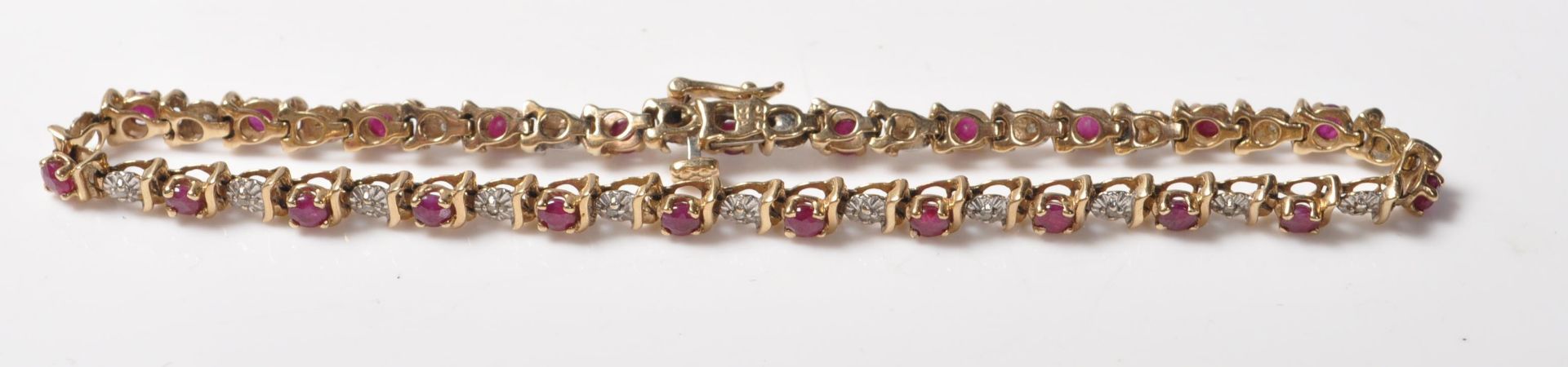 9CT GOLD RED STONE AND DIAMOND LINE BRACELET