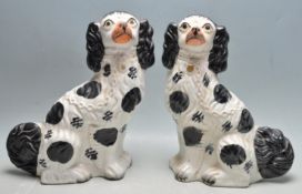 EARLY 19TH CENTURY STAFFORDSHIRE POTTERY DOGS