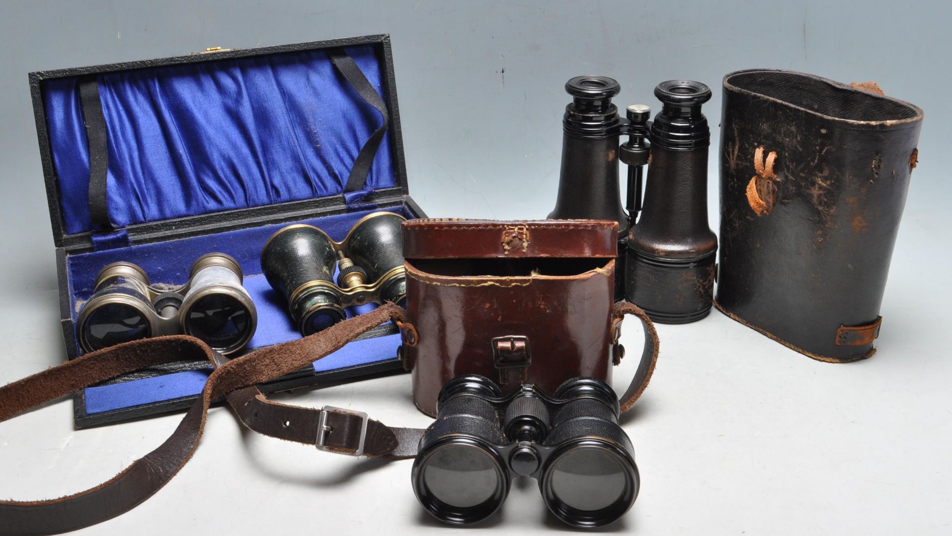 GROUP OF FOUR 19TH AND 20TH CENTURY BINOCULARS