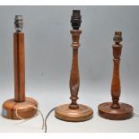 THREE VINTAGE 20TH CENTURY TEAK WOOD DESK LAMP BASES