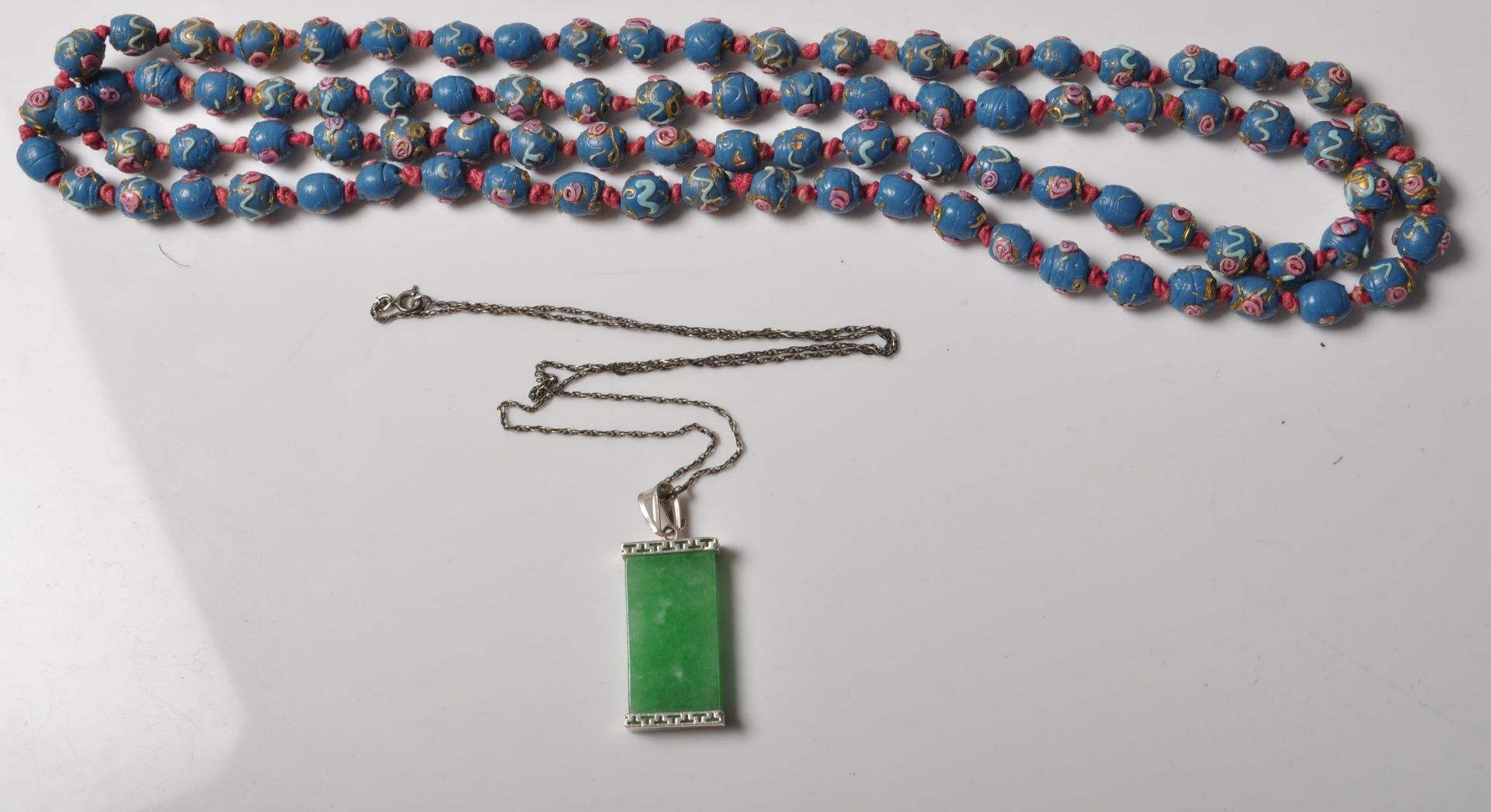 19TH CENTURY BOHEMIAN BEADED NECKLACE TOGETHER WITH A CHINESE GREEN STONE PENDANT NECKLACE