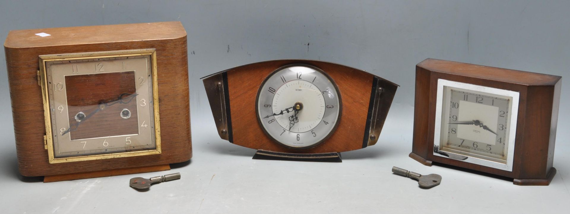 THREE RETRO 1960S MANTLE CLOCKS BY METAMEC AND SMITHS.