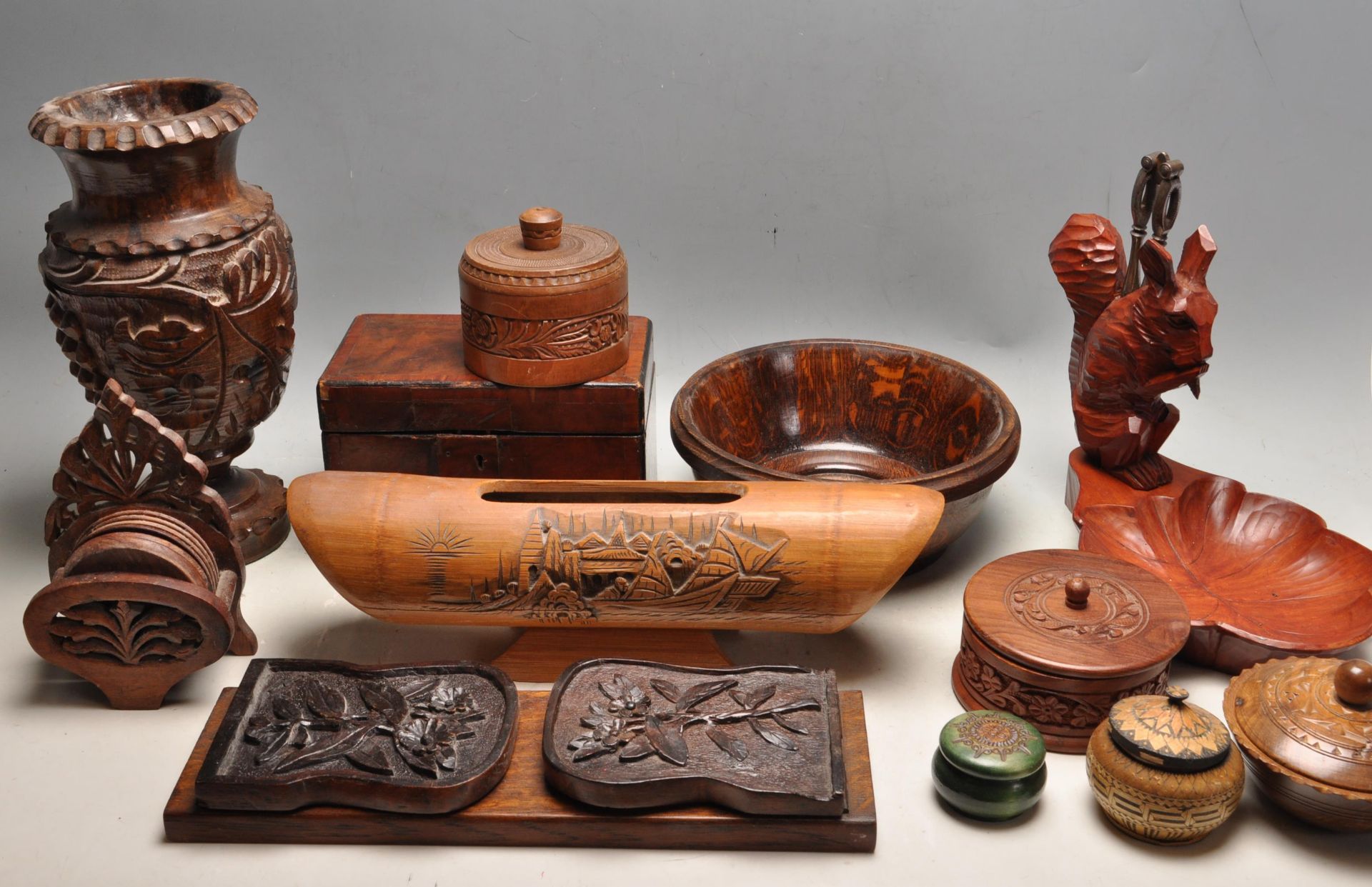 LARGE COLLECTION OF HAND CARVED BOXES, JARS, BOOKENDS