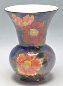 ROYAL DOULTON A VASE IN THE MANNER OF ARTHUR BAILEY