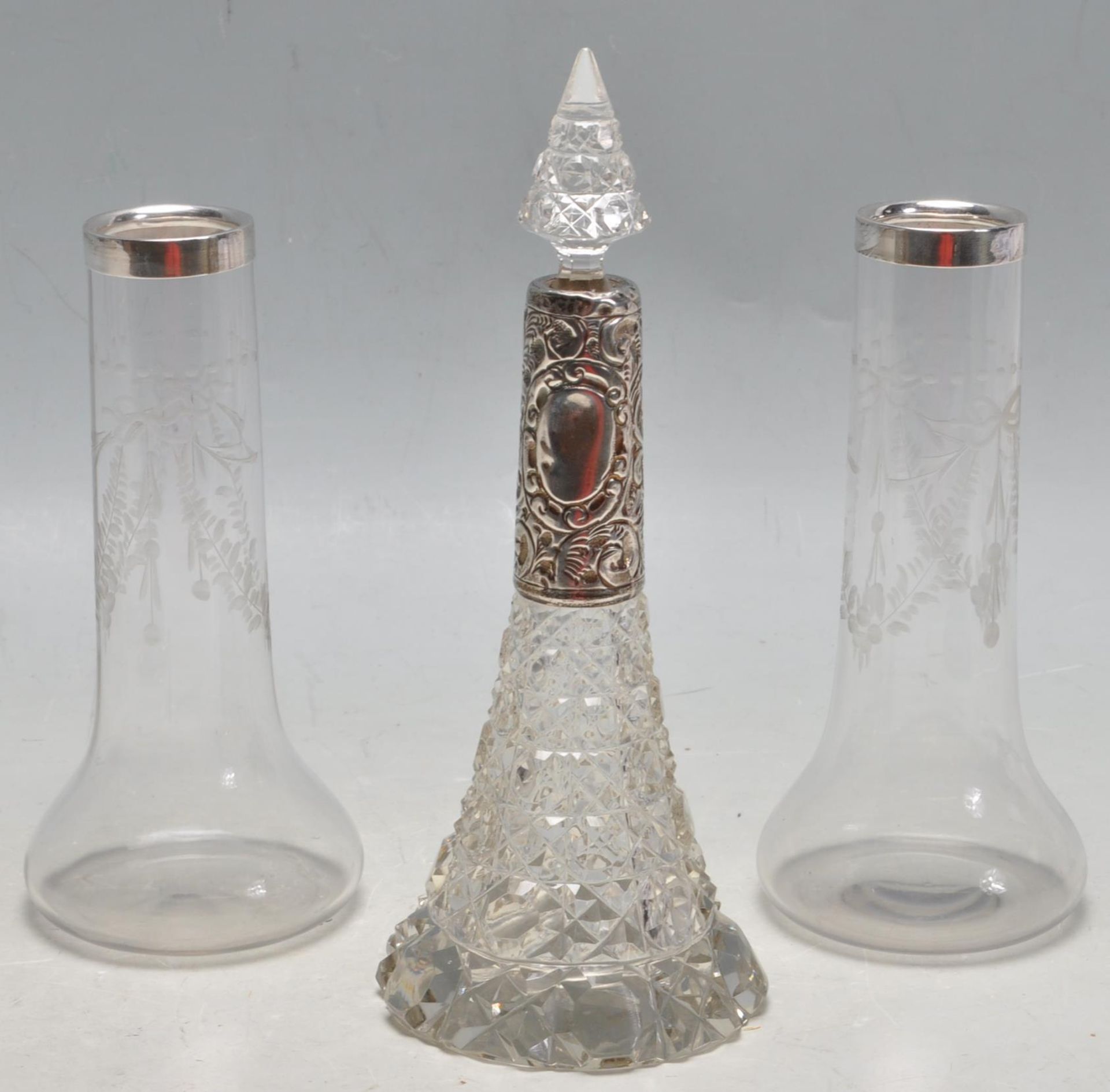1905 EDWARDIAN SILVER AND CUT GLASS PERFUME BOTTLE ALONG WITH A PAIR OF GLASS AND SILVER VASES