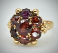 An 18ct Gold & Garnet Cluster Ring