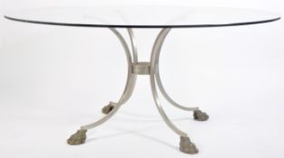 20TH CENTURY GLASS TOPPED TABLE RAISED ON BRASS HA