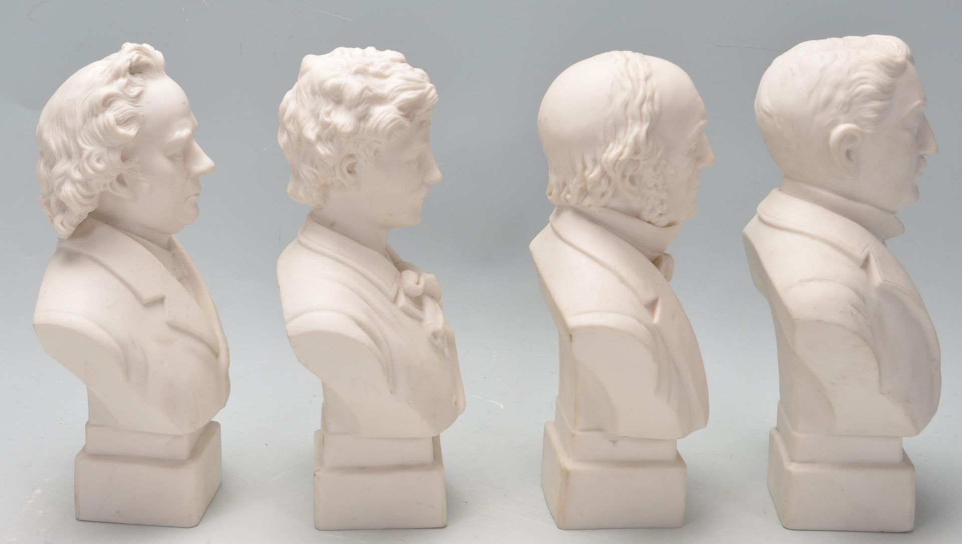 FOUR 20TH CENTURY BISQUE BUST FIGURINES