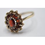 9CT GOLD AND RED STONE CLUSTER RING