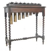 MID 20TH CENTURY GLOCKENSPIEL ON OAK STAND