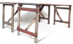 TWO INDUSTRIAL WOODEN PLANKED TRESTLE TABLES