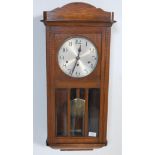 EARLY 20TH CENTURY OAK CASED WALL HANGING CLOCK