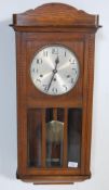 EARLY 20TH CENTURY OAK CASED WALL HANGING CLOCK