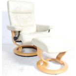 20TH CENTURY STRESSLESS STYLE ARMCHAIR AND STOOL