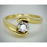 An 18ct Gold & Diamond Solitaire Crossover Ring