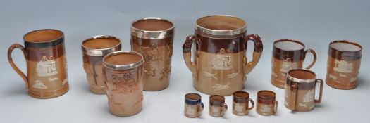 GROUP OF ANTIQUE DOULTON STONEWARE INCLUING SOME WITH SILVER COLLARS