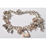 SILVER STAMPED 925 CHARM BRACELET. TOTAL WEIGHT 64 GRAMS.