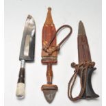 TWO TRIBAL KNIVES AND A HORN HANDLED KNIFE