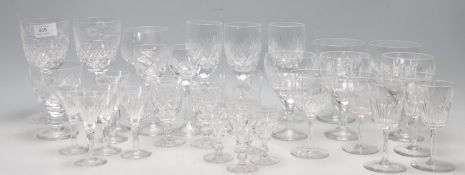 LARGE QUANTITY OF CRYSTAL GLASS DRINKING GLASSES