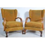 TWO ART DECO YELLOW FABRIC WINGBACK ARMCHAIRS